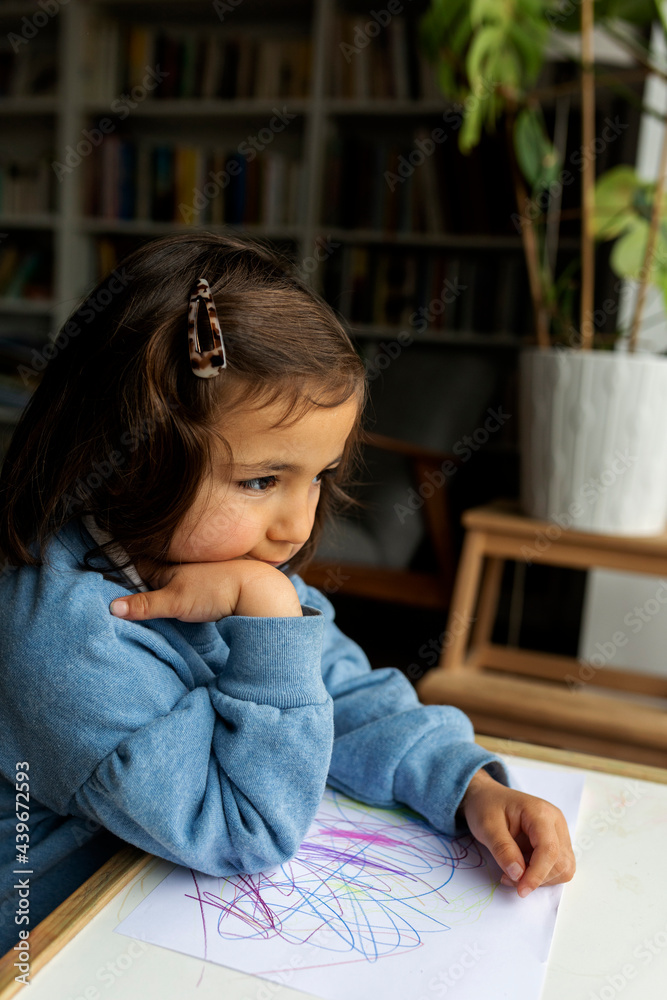 cute little girl looking through the window cute little girl looking through the window