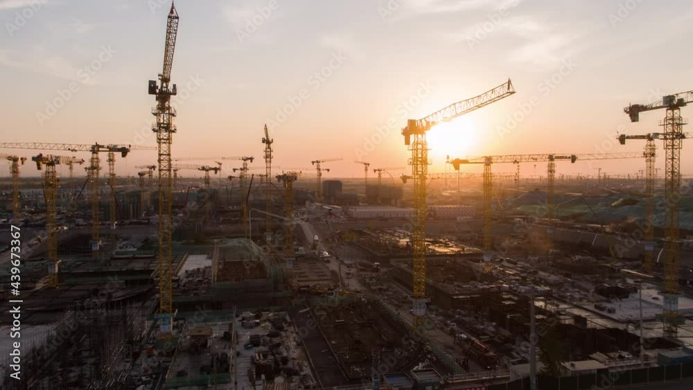 Aerial Flight Over a New Constructions Development Site with High Tower Cranes Building Real Estate. Heavy Machinery and Construction Workers are Employed. Xiongan new area of Beijing china. Aerial Flight Over a New Constructions Development Site with High Tower Cranes Building Real Estate. Heavy Machinery and Construction Workers are Employed. Xiongan new area of Beijing china.
