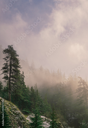 foggy mountain winter sunrise with blue sky