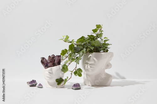 Amethyst crystals in ceramic pot photo