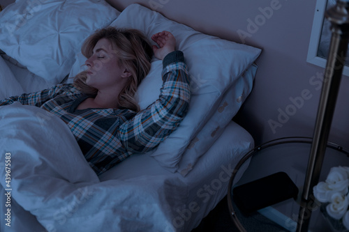 Home: Tired Woman Asleep In Her Bed