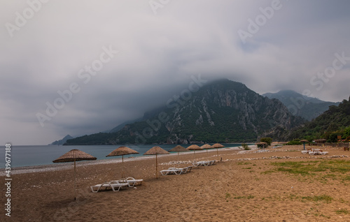 Morning on the beach in the village of Cirali. Blue bay in the Mediterranean at dawn. Landscapes of the Lycian Trail. May 2021. Long exposure picture