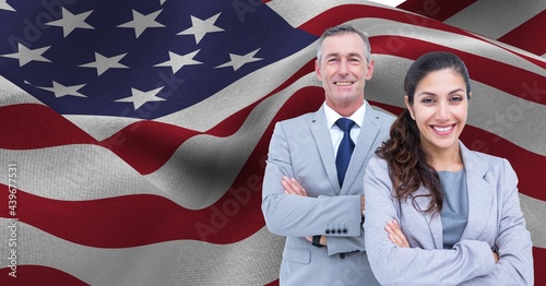 Composition of portrait of smiling businessman and businesswoman over billowing american flag