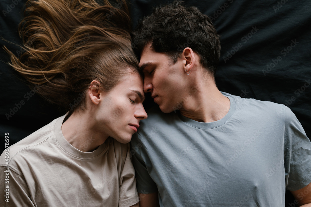 Boyfriends resting on bed with closed eyes Boyfriends resting on bed with closed eyes