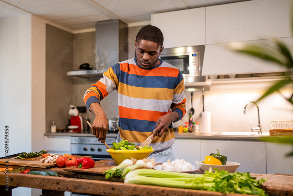 Black Man Cooking At Home. Black Man Cooking At Home.