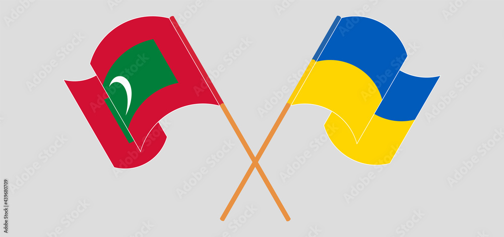 Crossed and waving flags of Maldives and Ukraine Crossed and waving flags of Maldives and Ukraine