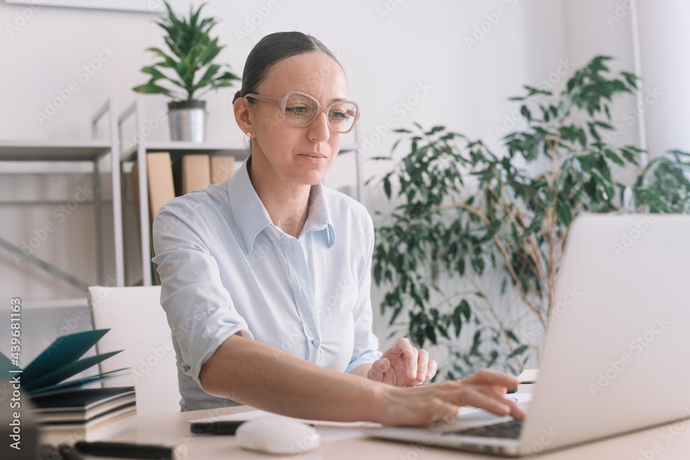 Woman Working At Her Desk in Coworking Space