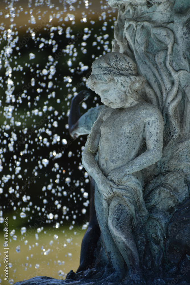 New Ulm, MN USA - 06-14-2021 - Close up of Cherub in the Water Fountain in German Park
