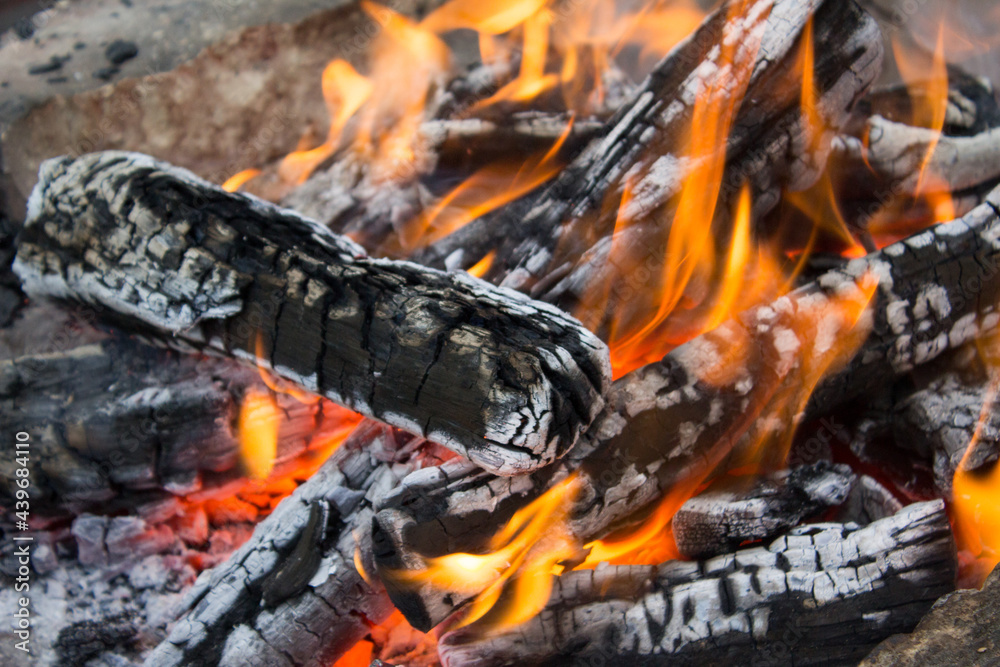 Hot burning wood log fire. Texture fire bonfire embers. Hot burning wood log fire. Texture fire bonfire embers.