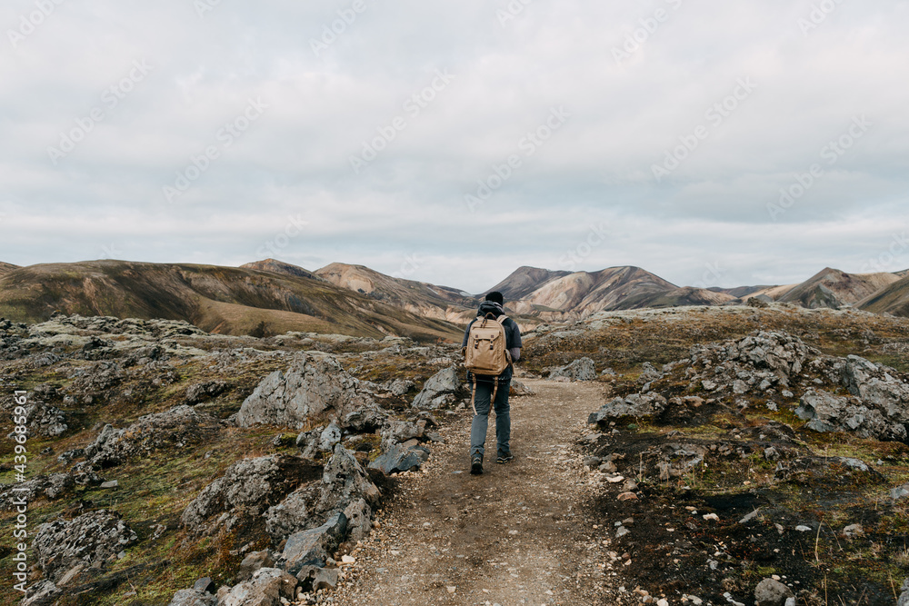 A male hiker walking the Laugavegur trail. A male hiker walking the Laugavegur trail.