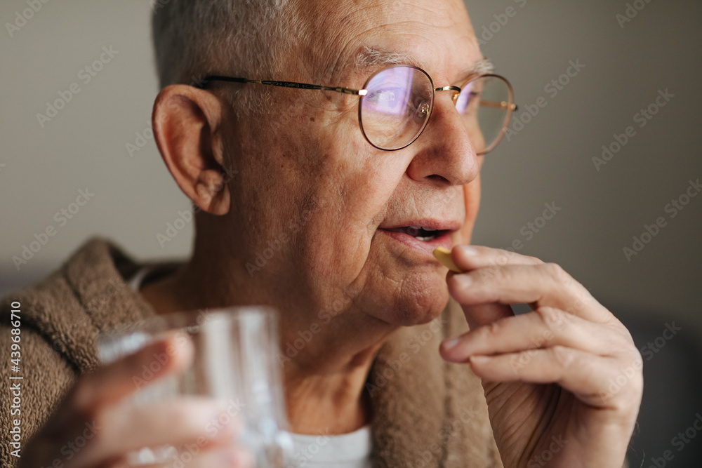 Old Man Taking a Pill Old Man Taking a Pill