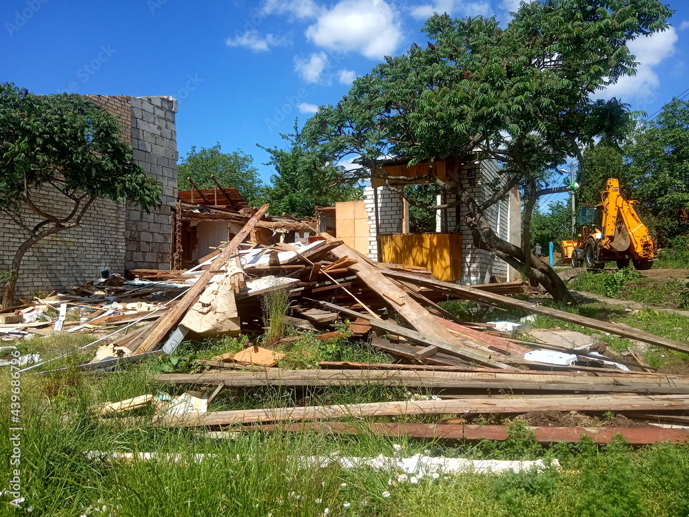 wreckage of an old destroyed wooden house, demolition of a private sector
