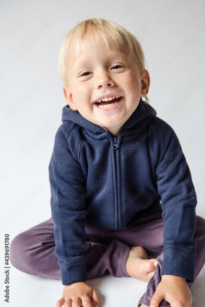 Portrait of a happy blonde boy in studio Portrait of a happy blonde boy in studio