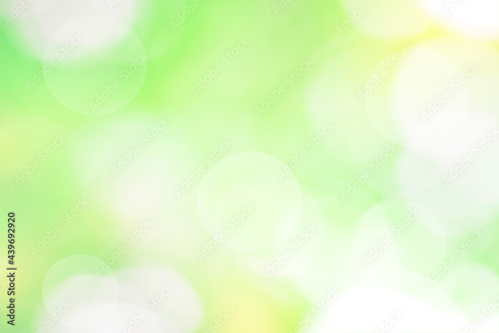 Defocused abstract nature background with green and yellow foliage, sun highlights and bokeh lights. Defocused abstract nature background with green and yellow foliage, sun highlights and bokeh lights.
