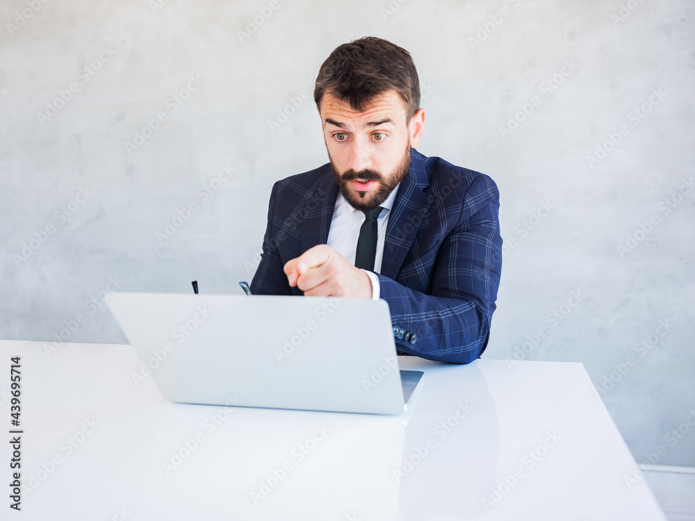 Handsome businessman making online conversation with his employees.