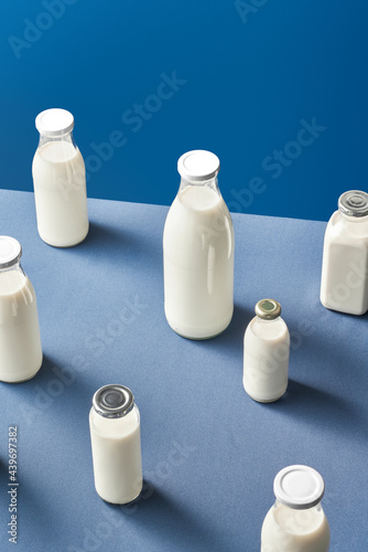 Composition of dairy bottles with metal lids photo