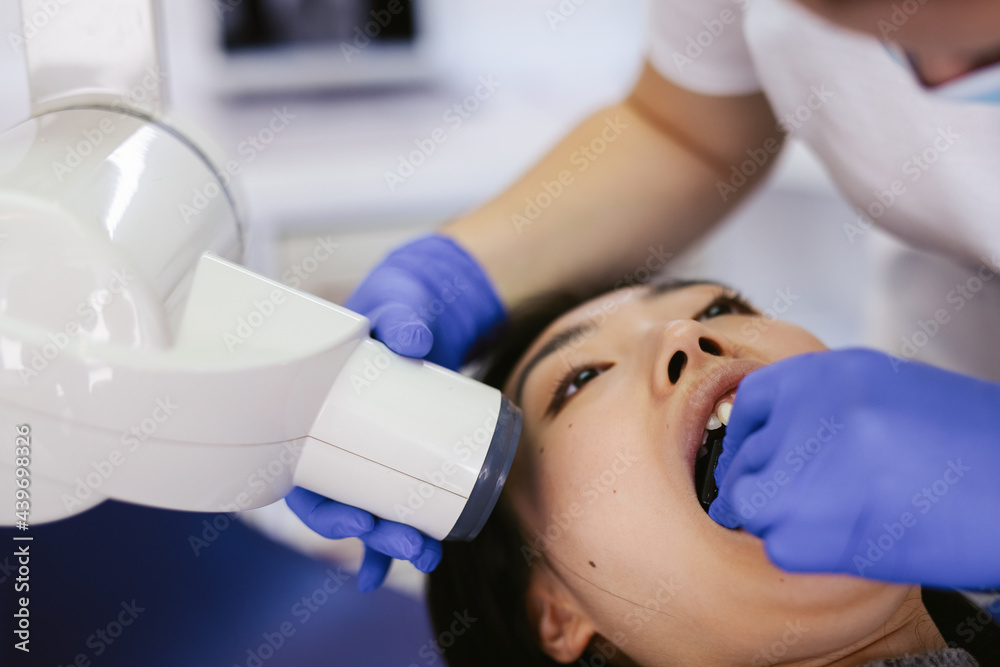 Dentist making x ray scan of jaw Dentist making x ray scan of jaw