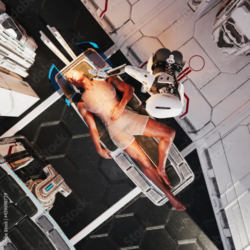 Man receiving medical assistance from robots in futuristic medical bay