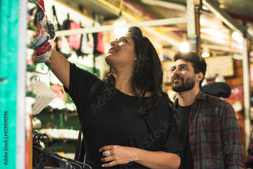 Latina woman shopping on a souvenir shop