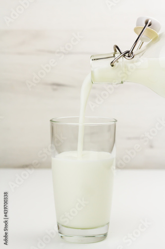 Kefir, ayran, yoghurt in a glass on light background