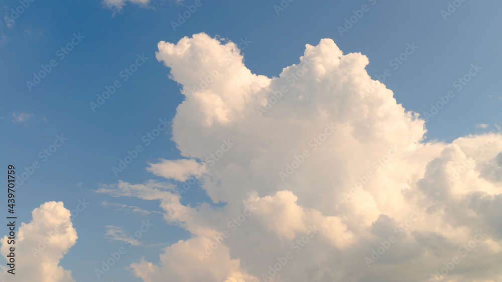 Fluffy white clouds on a blue sky