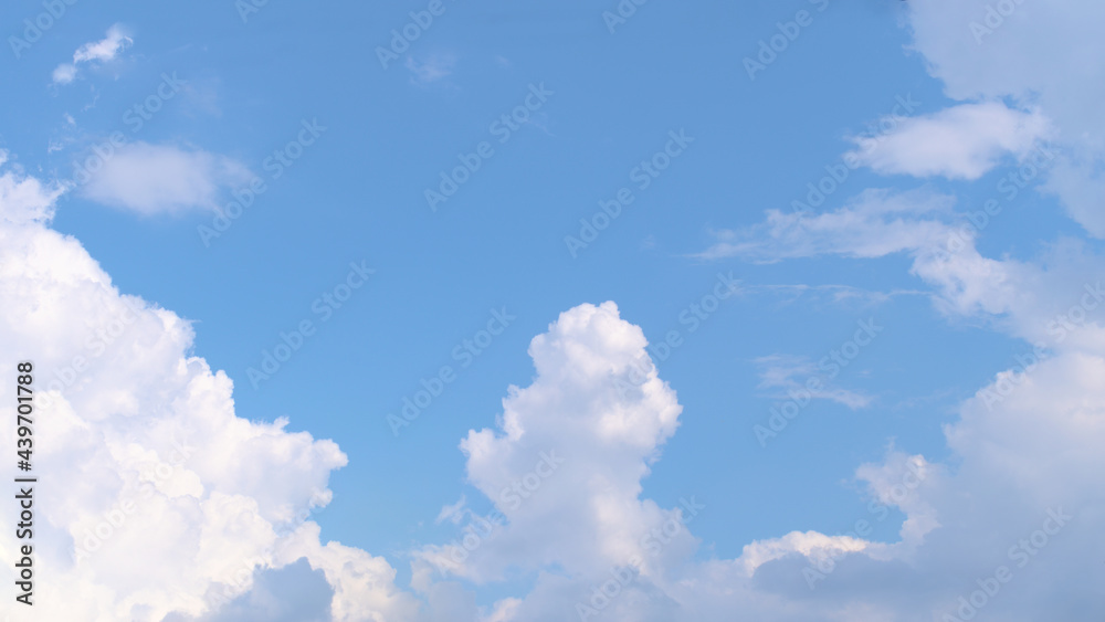 Fluffy white clouds on a blue sky
