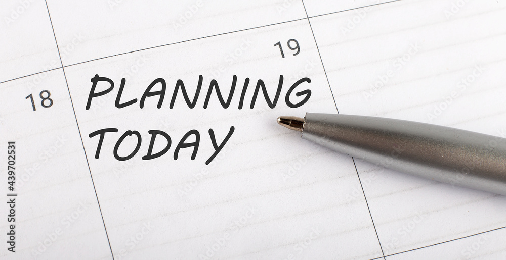 Text PLANNING TODAY on calendar planner to remind you an important appointment with a pen on isolated white background. Text PLANNING TODAY on calendar planner to remind you an important appointment with a pen on isolated white background.