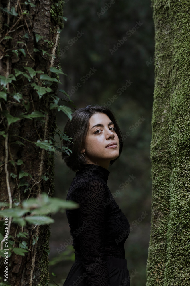 Portrait Of Young Woman In The Forest Looking At Camera Portrait Of Young Woman In The Forest Looking At Camera