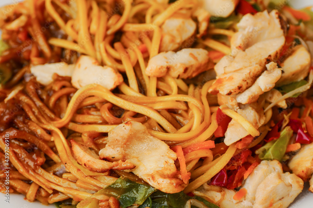 Chicken chow mein with noodle, close up. Asian style food range. Taste of Orient. Chicken chow mein with noodle, close up. Asian style food range. Taste of Orient.