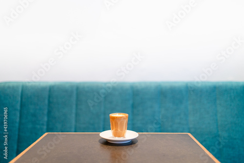 Single small cortado coffee on the table  photo