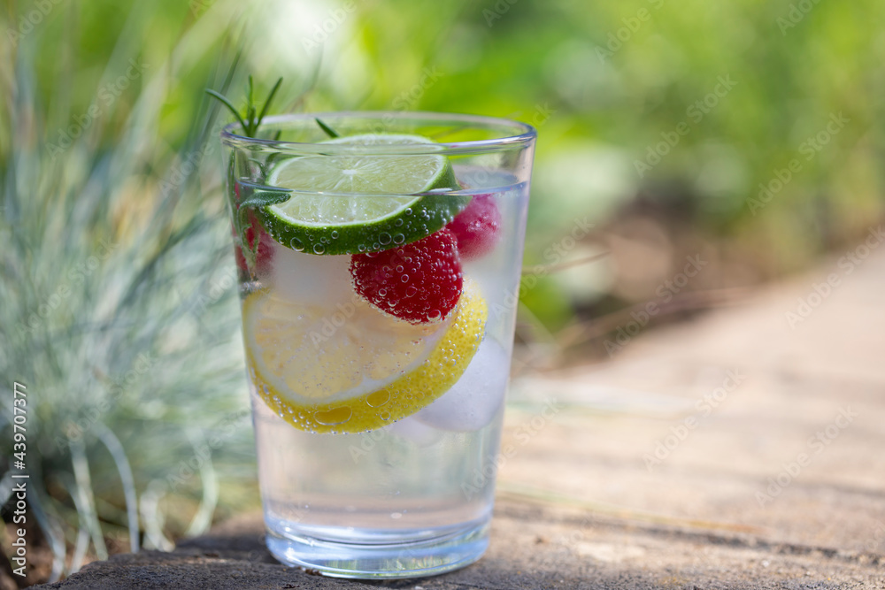 Gin and toinic drink in the garden on summer day Gin and toinic drink in the garden on summer day
