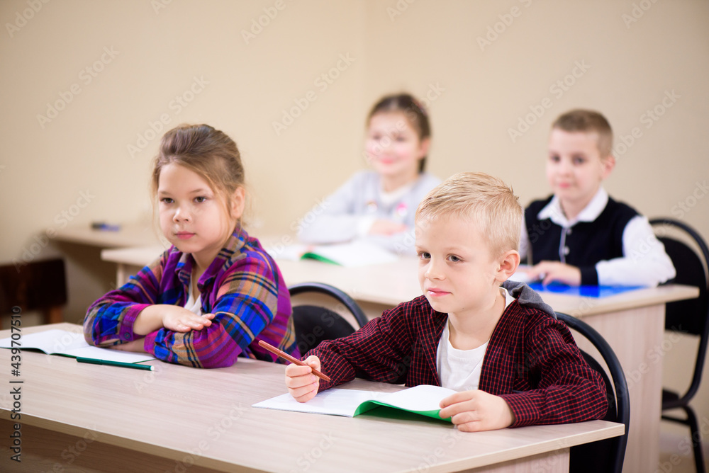 Primary school children work together in class. Primary school children work together in class.
