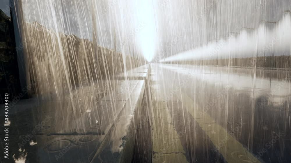 Raindrops bouncing off the surface of a rain-soaked sidewalk and road surface, with audio. Raindrops bouncing off the surface of a rain-soaked sidewalk and road surface, with audio.