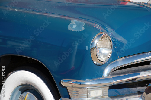 Front fender of an old car in parking lot in Arizona