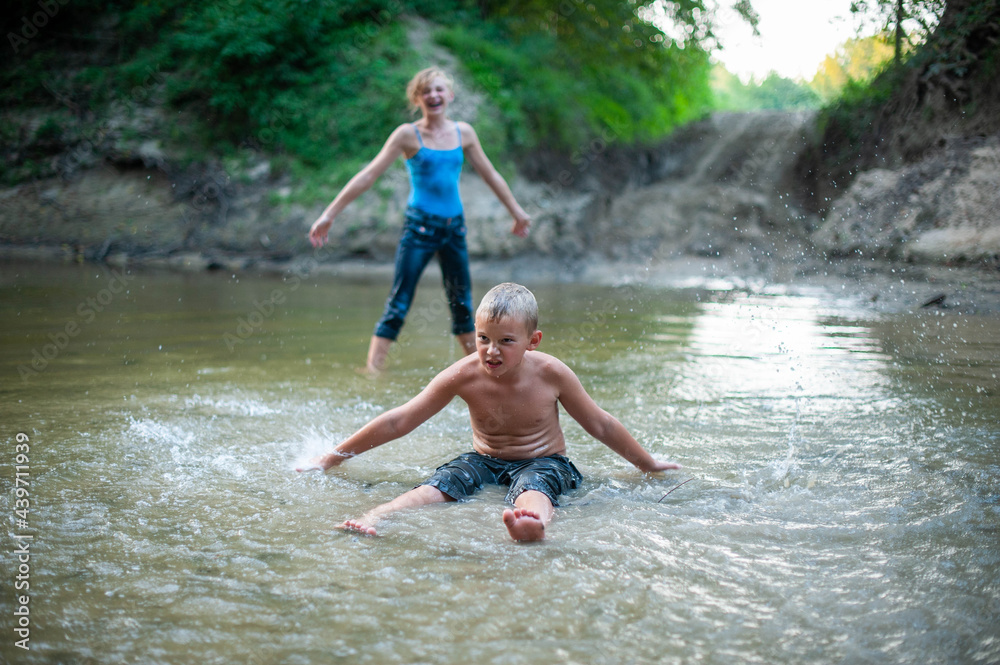 Kids Playing in a River Kids Playing in a River