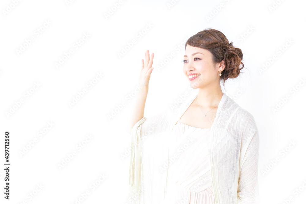 手を振るドレスの女性 手を振るドレスの女性