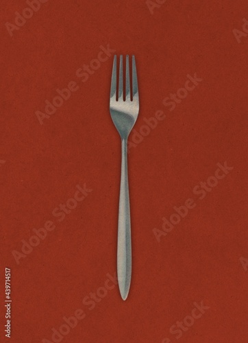 fork on red background photo