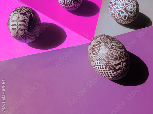 Custom made handmade easter eggs arrangement in pastel colored papers / background photo