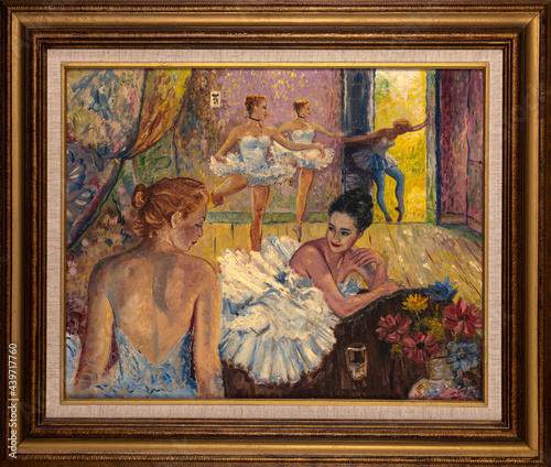 Framed oil painting representing young ballerinas dressed in tutu skirts in their studio.