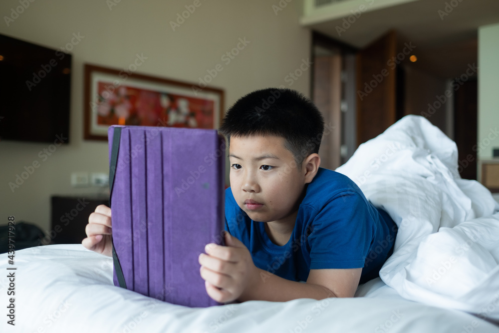 asian chinese boy playing smartphone, kid use phone and play game, addicted game and cartoon asian chinese boy playing smartphone, kid use phone and play game, addicted game and cartoon