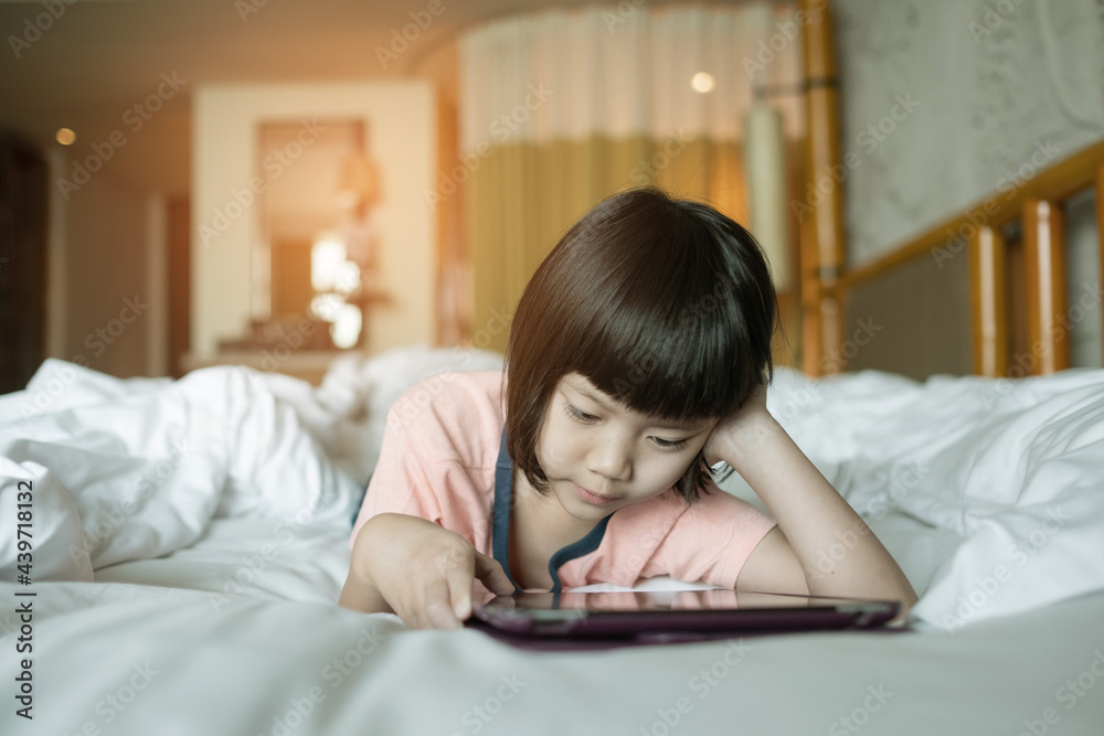 kid is addicted to tablet, little girl playing smartphone, kid use telephone, watching cartoon kid is addicted to tablet, little girl playing smartphone, kid use telephone, watching cartoon