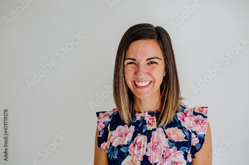 Smiling woman in sleeveless blouse photo