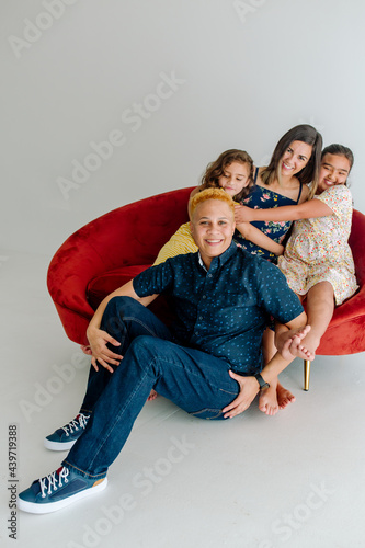 Beautiful nontraditional family on couch photo