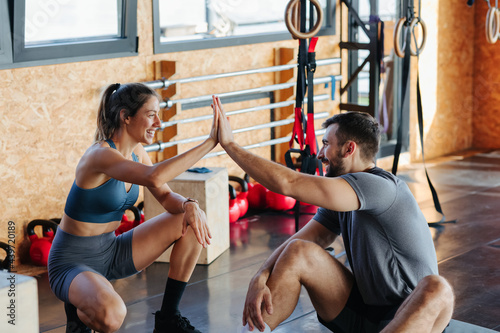 Man and Woman Resting in Gym