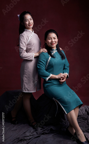 Asian mother and daughter portrait, indoors photo