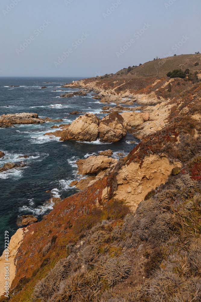 A rocky shoreline on a sunny day A rocky shoreline on a sunny day