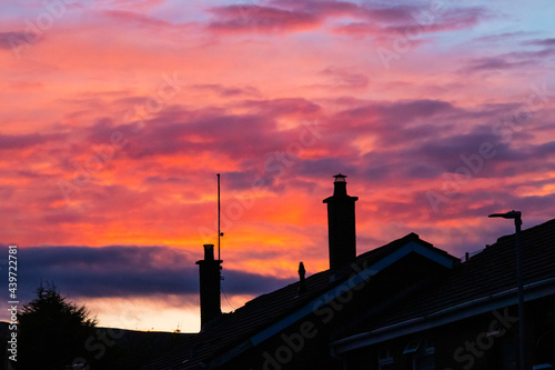 sunset over rooftops in belfast, northen ireland