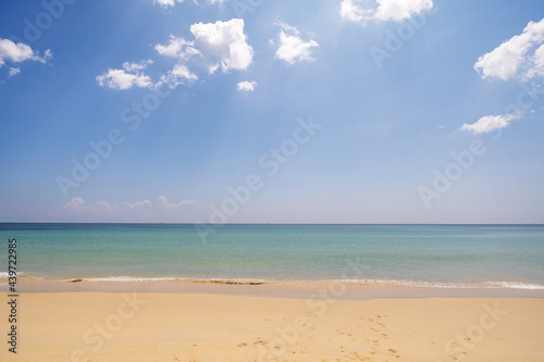 Empty tropical summer beach background Horizon with sky and white sand beach Wave crashing on sandy shore.