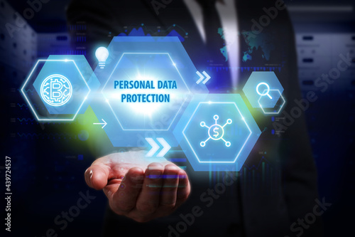 Business, Technology, Internet and network concept. Young businessman working on a virtual screen of the future and sees the inscription: Personal data protection