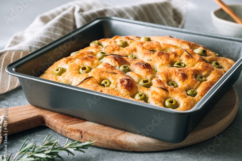 Homemade focaccia with olives and rosemary photo